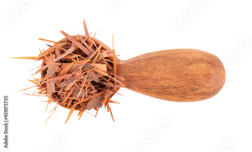 Lapacho herbal tea in wooden spoon, isolated on white background. Natural Taheeboo dry tea. Pau d'arco herb. Tabebuia heptophylla. Top view. photo