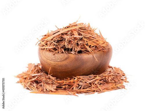 Lapacho herbal tea in wooden bowl, isolated on white background. Natural Taheeboo dry tea. Pau d'arco herb. Tabebuia heptophylla. photo