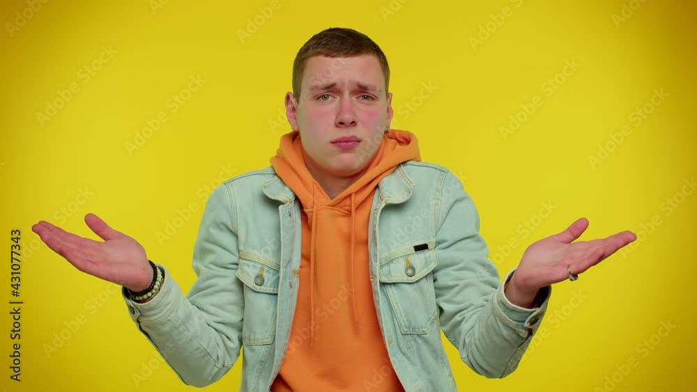 No idea, I dont know answer. Puzzled clueless uncertain sincere teen student boy 18 years old raising hands in helpless gesture, embarrassed confused by difficult question. Young man in denim jacket No idea, I dont know answer. Puzzled clueless uncertain sincere teen student boy 18 years old raising hands in helpless gesture, embarrassed confused by difficult question. Young man in denim jacket