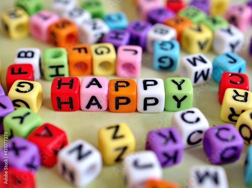 Colorful alphabet beads on white background ,blocks spell out word .love and happy