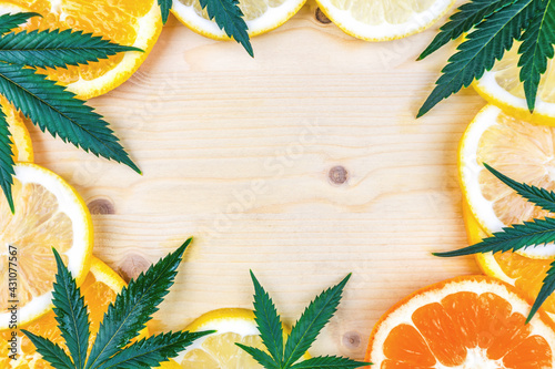 Cannabis Terpene concept with leafs lemon orange and blood orange and copy space photo