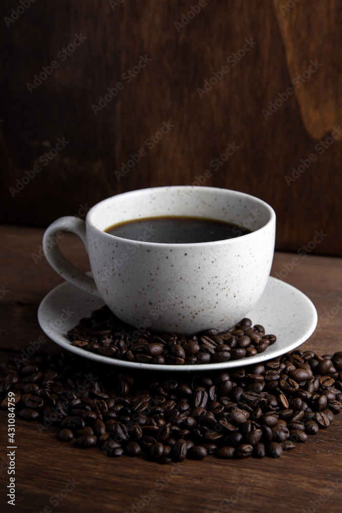 Fototapeta premium Coffe cup with milk and coffee grains
