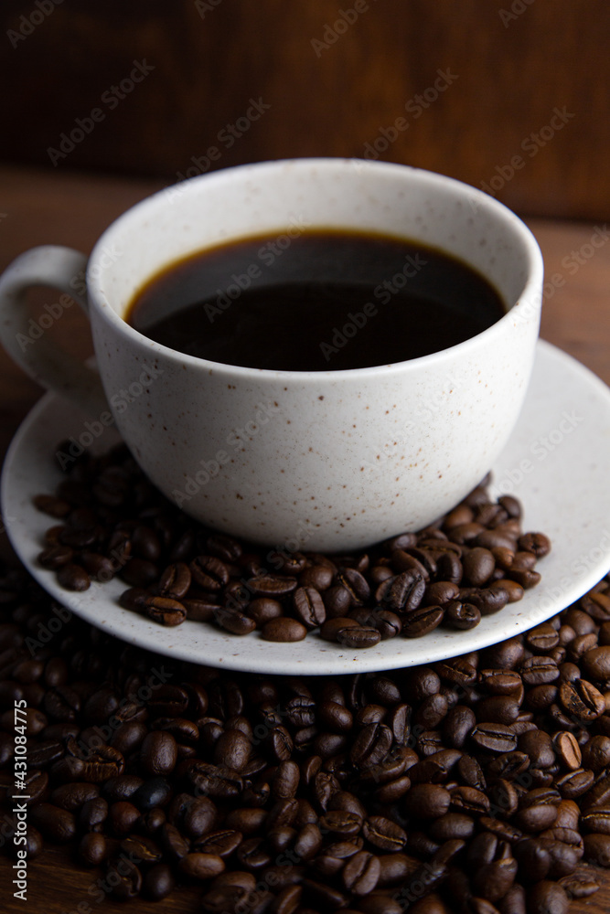Coffe cup with milk and coffee grains Coffe cup with milk and coffee grains