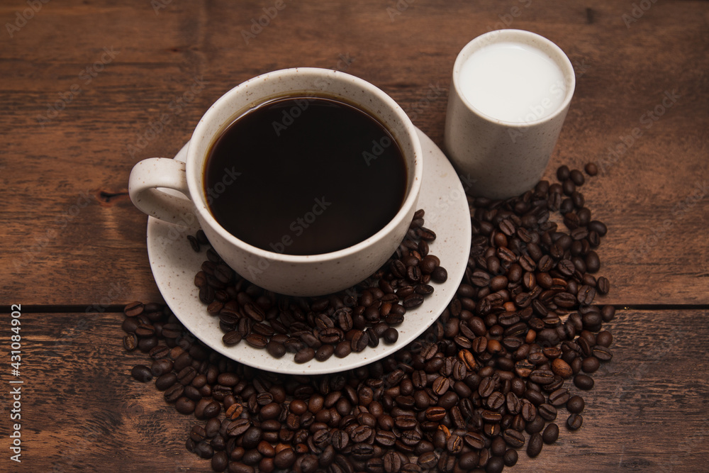 Coffe cup with milk and coffee grains Coffe cup with milk and coffee grains