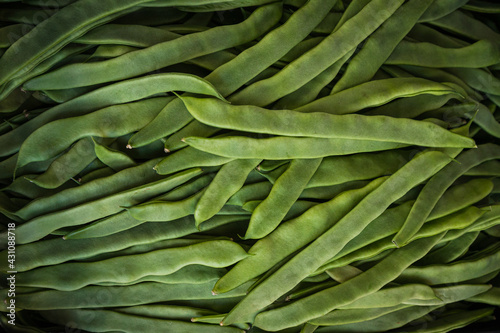 Foto Close up of the pile of green wax beans  , top view