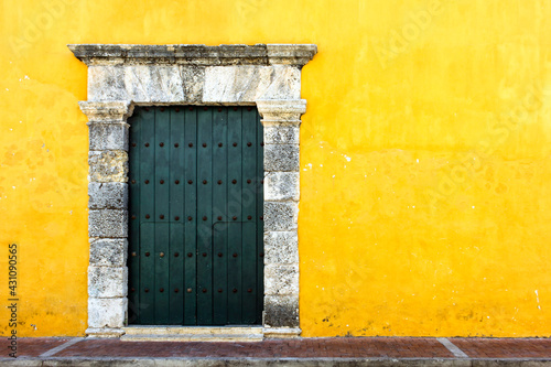 Yellow colonial style wall for a facade in Cartagena, Colombia
