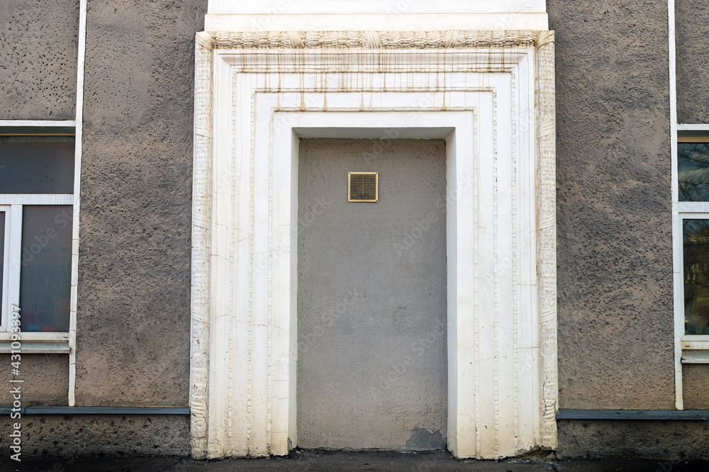 A false door in a beautiful concrete frame. Opening for ventilation. Building. A false door in a beautiful concrete frame. Opening for ventilation. Building.