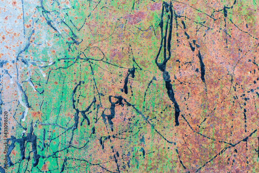 Rusty metal surface with multicolored paint splashes. Colors - green, white, black.