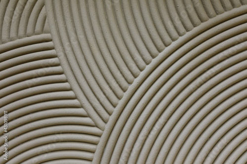 Gray concrete cement background with circles and spirals