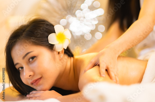 Asian Beautiful young and healthy woman in spa salon. Massage treatment spa room.Traditional medicine and healing concept.