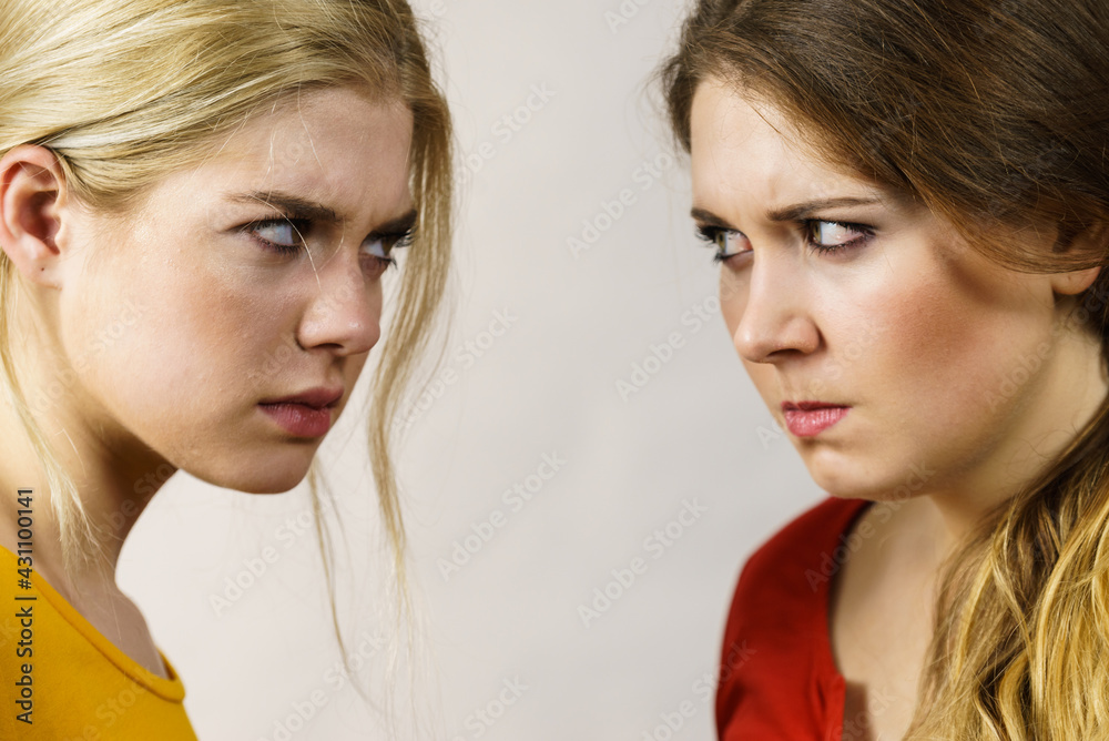 Angry girls looking at each other Angry girls looking at each other
