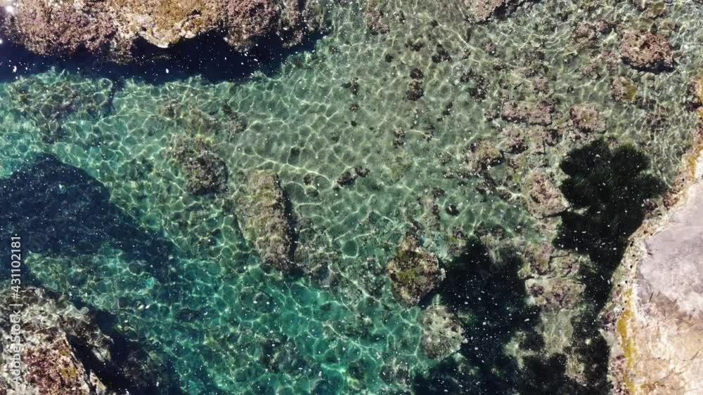 Aerial view. Clear blue sea water with stone rocky shore. Spanish coast nature. Mediterranean Sea. Aerial view. Clear blue sea water with stone rocky shore. Spanish coast nature. Mediterranean Sea.