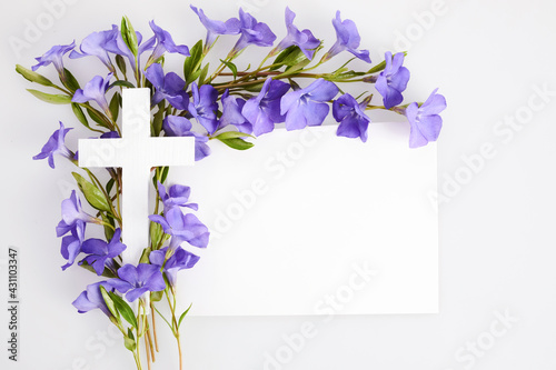 Bild auf Leinwand The Christianity cross of beautiful blue periwinkle flower