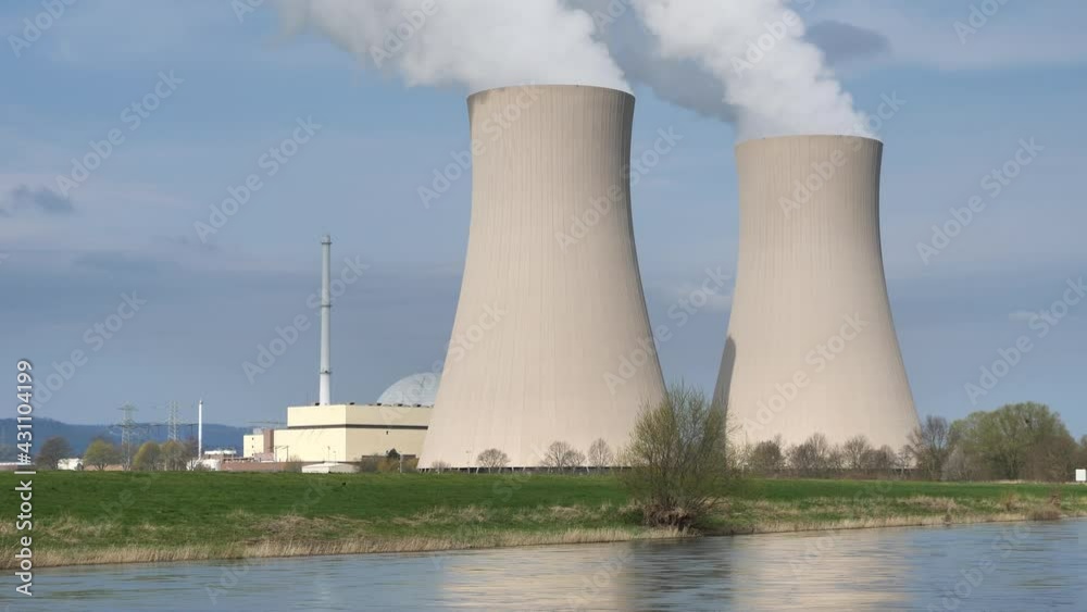 Nuclear power plant against sky at sunset Nuclear power plant against sky at sunset