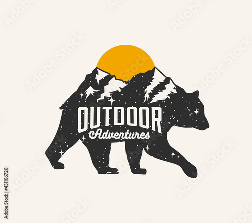 Outdoor adventures. Mountains touristic logo or badge or label or emblem design template with bear silhouette with mountains landscape on the back. Isolated on white background. Vector illustration