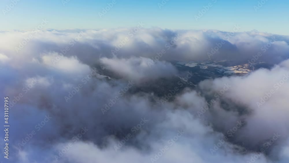 A beautiful and gentle view of an extraordinary and fluffy cloud valley and a bright orange sunset, aerial UHD 4K video A beautiful and gentle view of an extraordinary and fluffy cloud valley and a bright orange sunset, aerial UHD 4K video