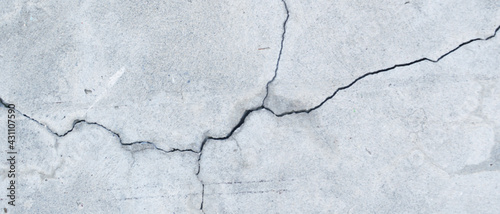Crack wall texture. Cracked concrete wall covered with cement surface as background. Wall fragment with scratches and cracks