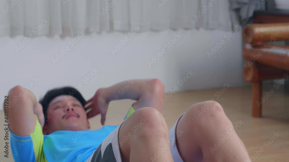 Asian Man Doing Abdominal Crunch Workout At Home
Asian Man Doing Abdominal Crunch Workout At Home