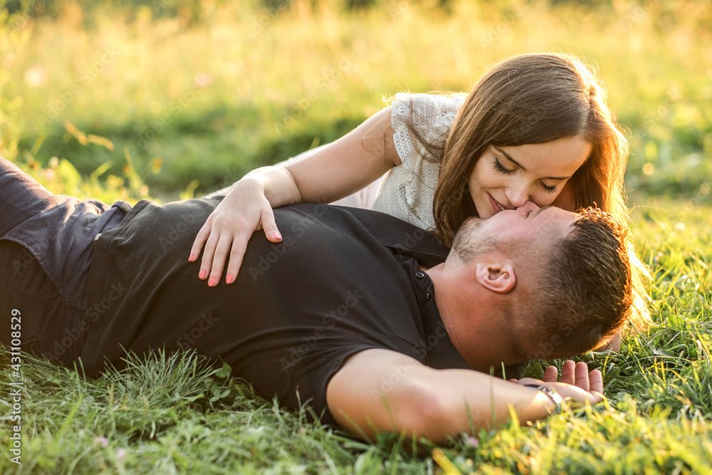 Couple lovers hugging and kissing in the park at sunset. Love, youth, happiness concept.
Couple lovers hugging and kissing in the park at sunset. Love, youth, happiness concept.