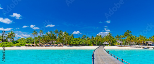 Fototapeta Naklejka Na Ścianę i Meble -  Maldives paradise scenery. Tropical aerial landscape, seascape with long jetty, water villas with amazing sea and lagoon beach, tropical nature. Exotic tourism destination banner, summer vacation