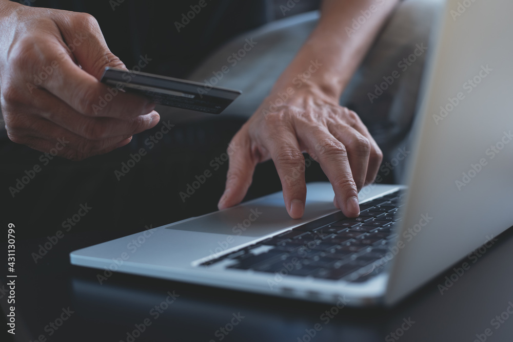 Internet payment and online shopping, E-commerce concept. Man using credit card and laptop for internet payment on laptop computer Internet payment and online shopping, E-commerce concept. Man using credit card and laptop for internet payment on laptop computer