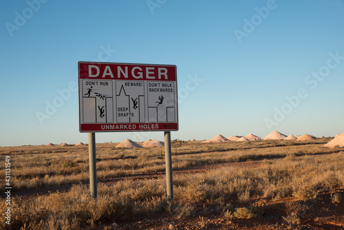  Opal Mining fields in Greater Coober Pedy with danger warning sign. photo