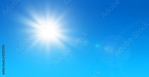 Sun with lens flare and blue sky background