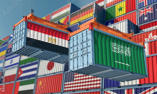 Freight containers with Egypt and Saudi Arabia national flags. 3D Rendering © Marius Faust