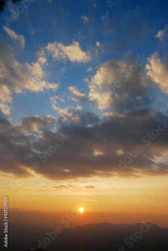 Nature Sky and White Clouds Texture Background - with orange light of sunset 
