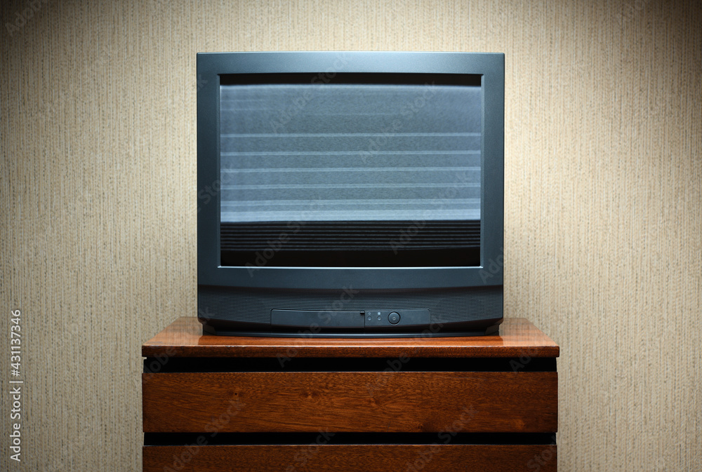 Old TV with clutter on the screen on an old table, vintage design in 80s  and 90s style. Photos | Adobe Stock