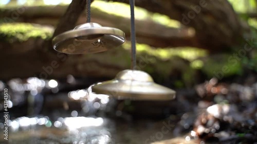 Cymbal sound healing instrument with refreshing water sound in the background photo