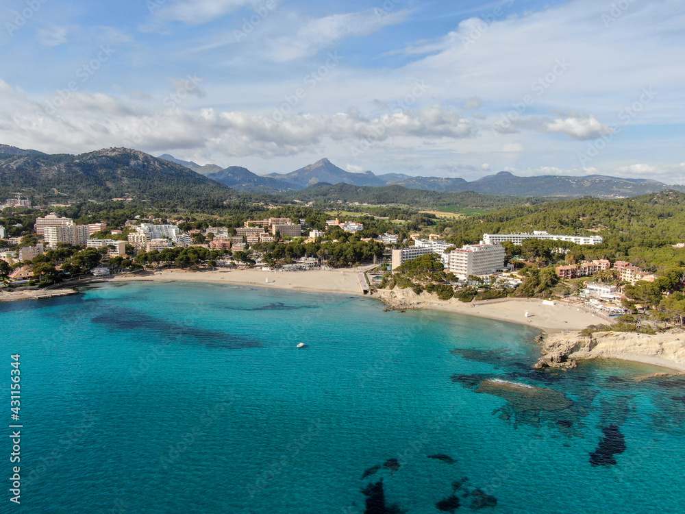  seacoast of the beach in mallorca with beaturiful view of the sea with crystalclear water. Sea view of turquoise colour. Concept of summer, travel, relax and enjoy	