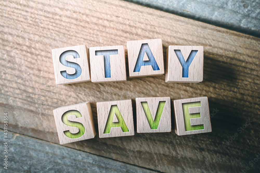 Fototapeta premium Stay Save Written On Wooden Blocks On A Board