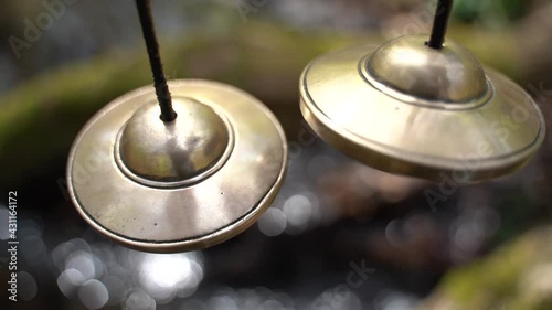 Cymbal sound healing instrument with refreshing water sound in the background photo
