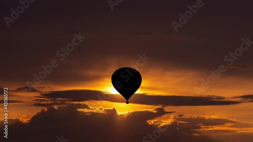 The flight on air balloon in the beautiful sunset sky