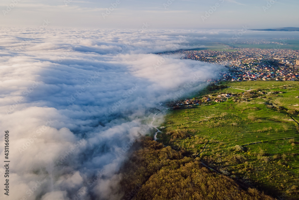 Aerial view with creeping clouds and mountains in Anapa.