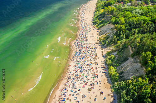 Crowded beach at Baltic Sea. Tourism in Poland. photo