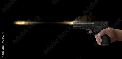 concept of freezing shot of a gun on a dark backgroundFreezing shot of a gun on a dark background. Concept gun club, gun-shop, shooting range