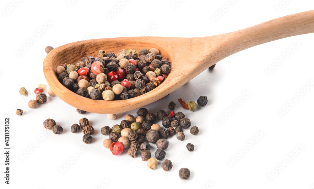 Spoon with peppercorns on white background Spoon with peppercorns on white background