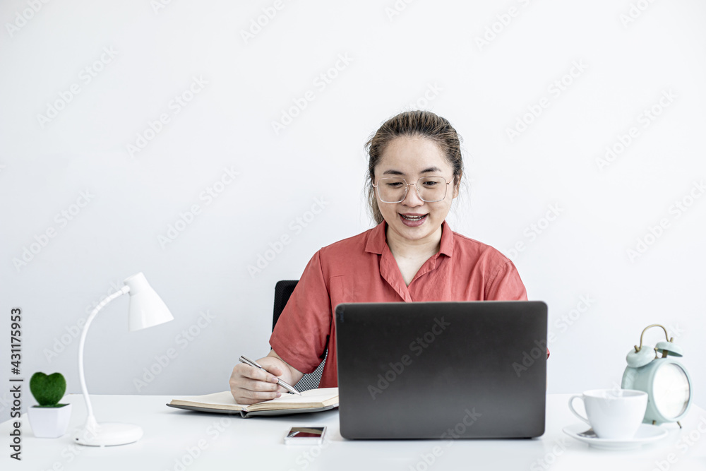 The businesswoman is on a teleconference with her partner and secretary, the company announces that employees work from home to prevent the spread of COVID-19. The idea of working from home. The businesswoman is on a teleconference with her partner and secretary, the company announces that employees work from home to prevent the spread of COVID-19. The idea of working from home.