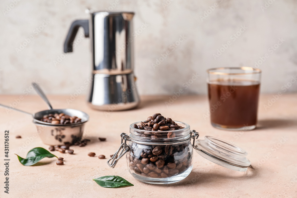 Jar with coffee beans on color background Jar with coffee beans on color background