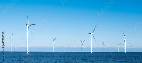 wind turbines in water of ijsselmeer near Urk in dutch part of noordoostpolder photo