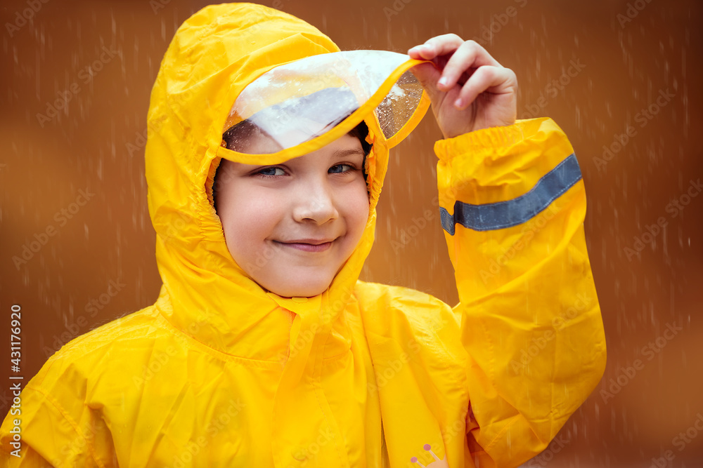 Boy in yellow raincoat on a deserted beach on a cloudy day
Boy in yellow raincoat on a deserted beach on a cloudy day