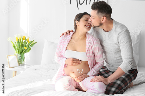 Beautiful pregnant couple a...
