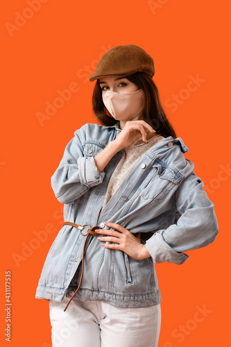 Fashionable young woman wea...