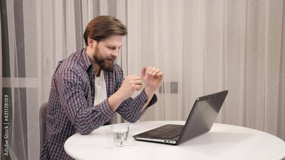 Thoughtful young man freelancer writer sit at home office desk with laptop typing thinking of inspiration search problem solution ideas lost in thoughts concept dreaming looking away in the evening. Thoughtful young man freelancer writer sit at home office desk with laptop typing thinking of inspiration search problem solution ideas lost in thoughts concept dreaming looking away in the evening.