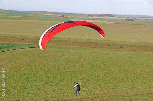 Paraglider flying at Milk Hill, Wiltshire