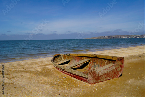 Old boat cape Kazantip summer. Shipwreck on a beach. photo