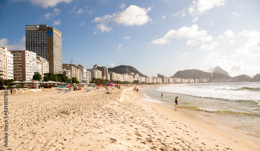 Citizens swim and sunbathe on the beach of Copacabana Citizens swim and sunbathe on the beach of Copacabana