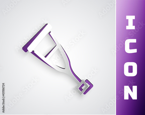 Paper cut Crutch or crutches icon isolated on grey background. Equipment for rehabilitation of people with diseases of musculoskeletal system. Paper art style. Vector